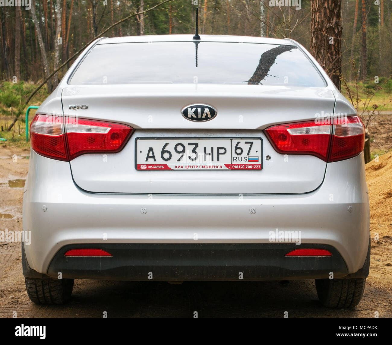 Smolensk, Russia - April 29, 2017: New Kia Rio parked in the forest, back side. Stock Photo