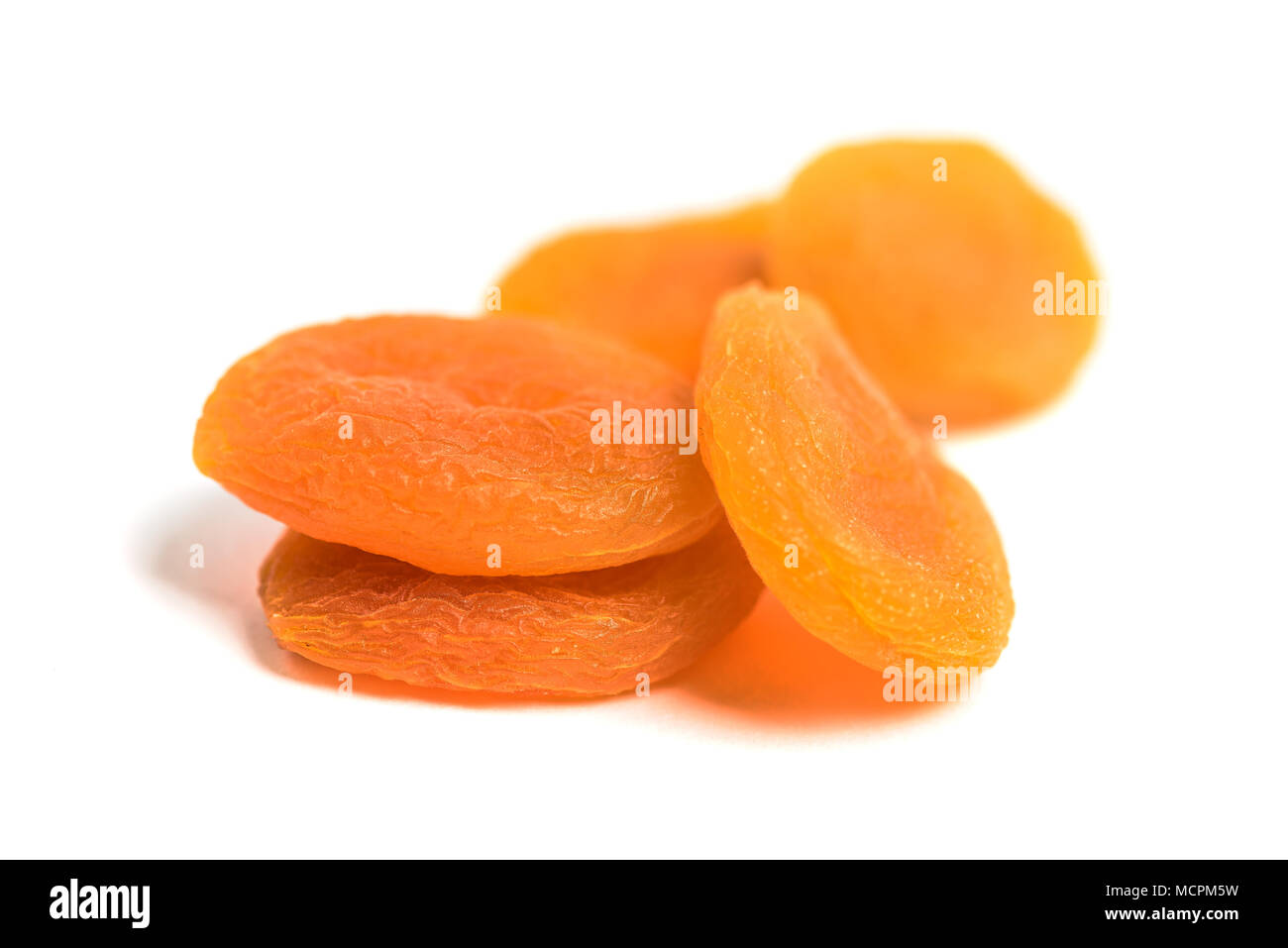 Arranged dried apricots isolated on white Stock Photo Alamy