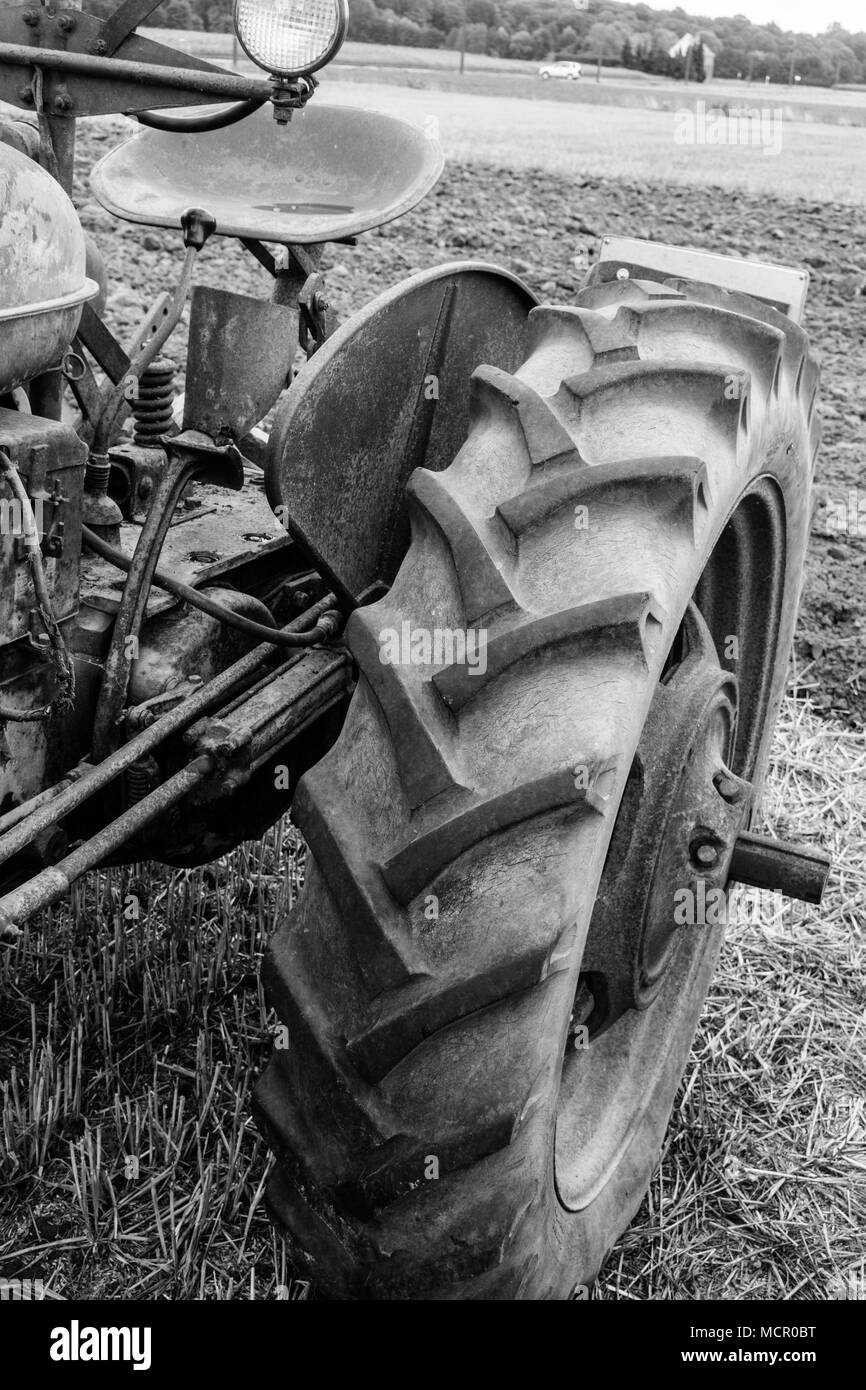 Old tractor on field Stock Photo - Alamy