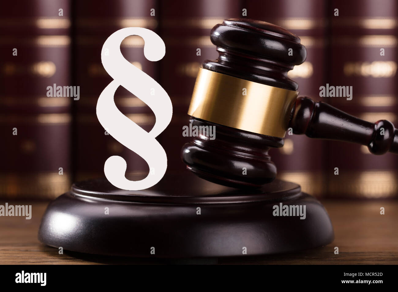 Close-up Of Gavel And Paragraph Sign In Courtroom Stock Photo