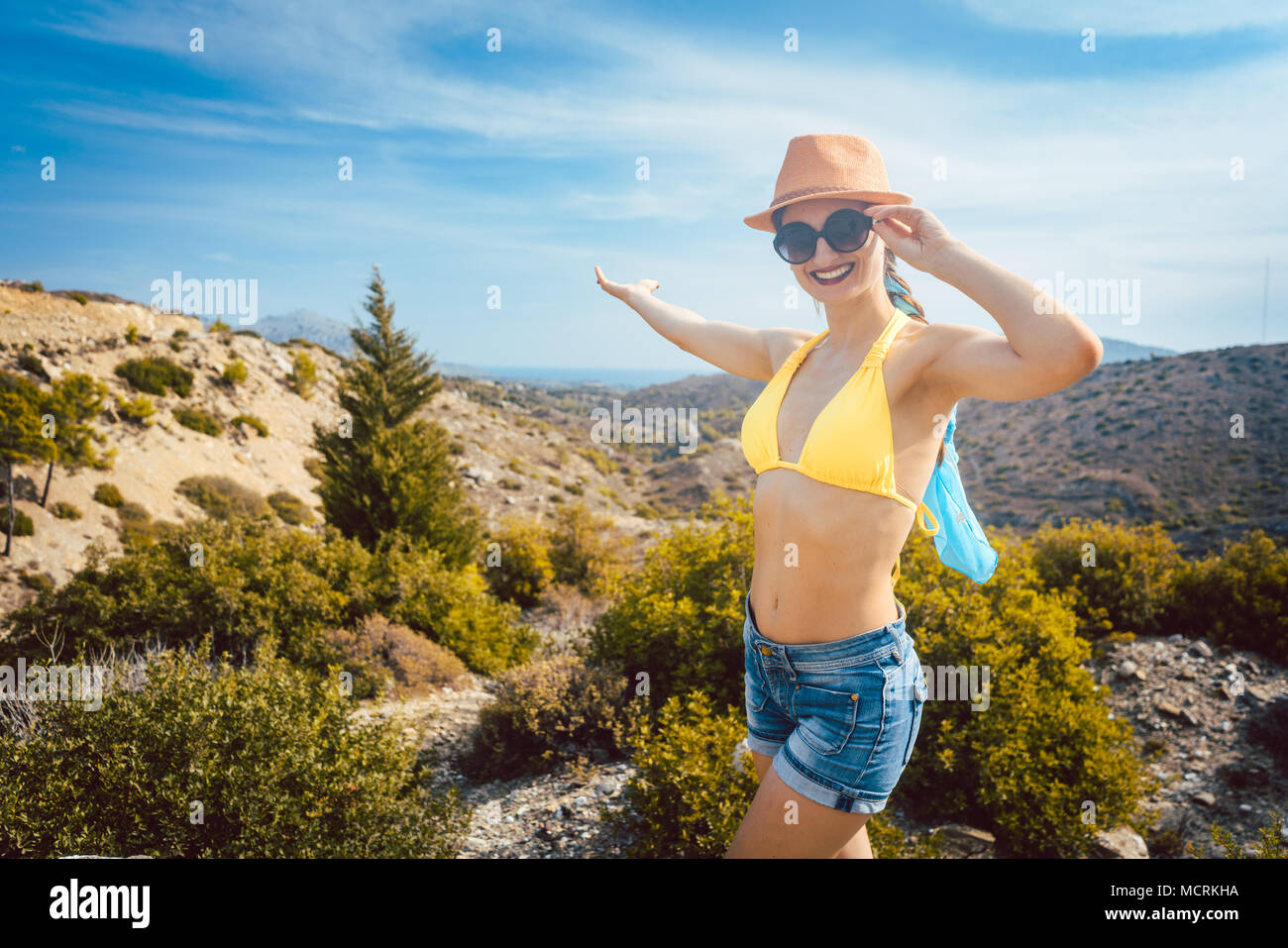 Woman tourist in front of southern European landscape Stock Photo