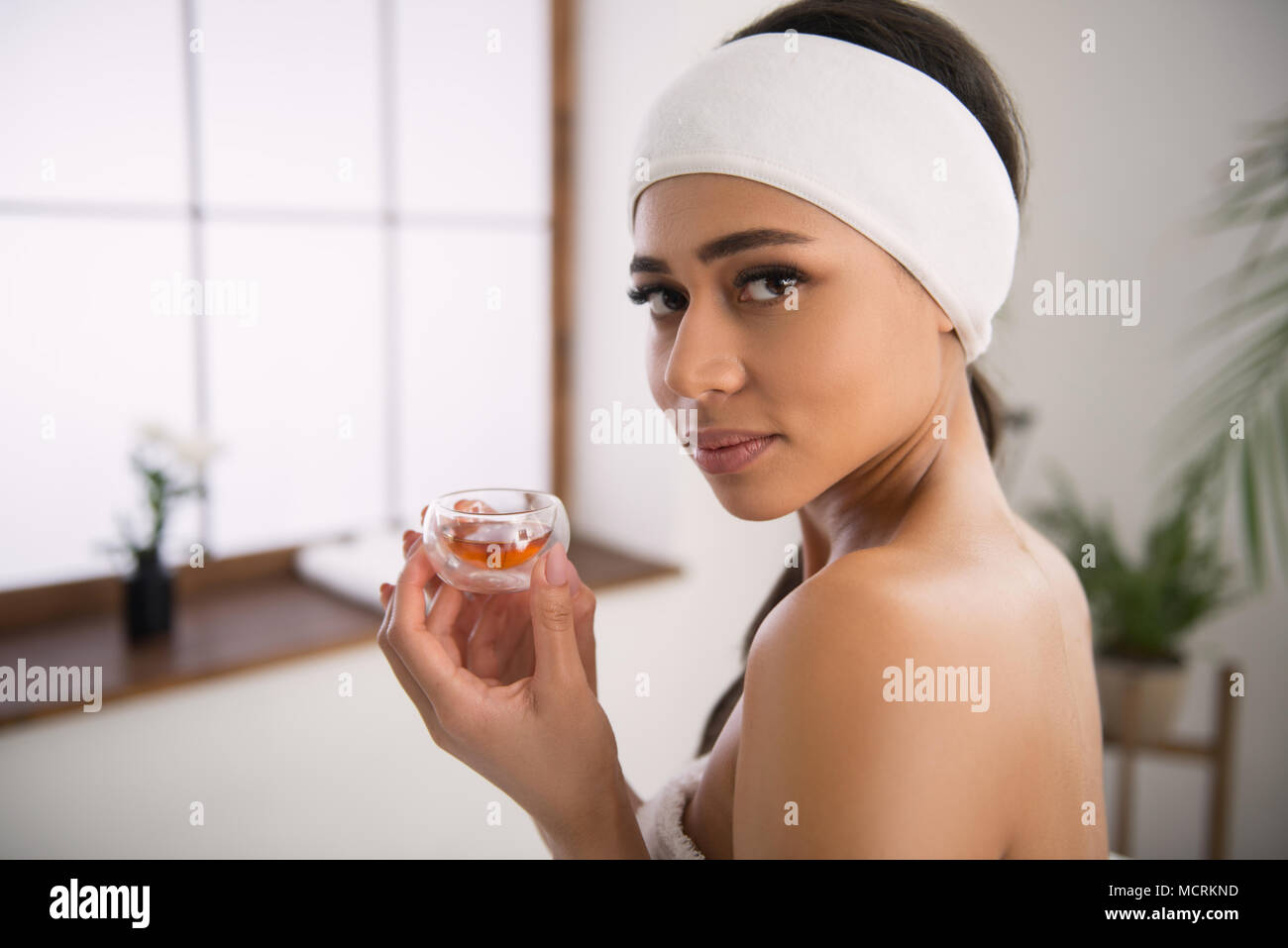 Nice beautiful woman holding oil Stock Photo