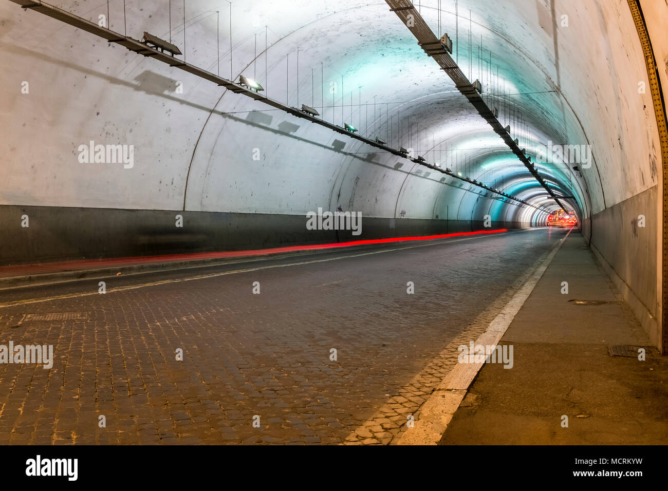 Long exposure of the inside of a artificially illuminated traffic tunnel Stock Photo
