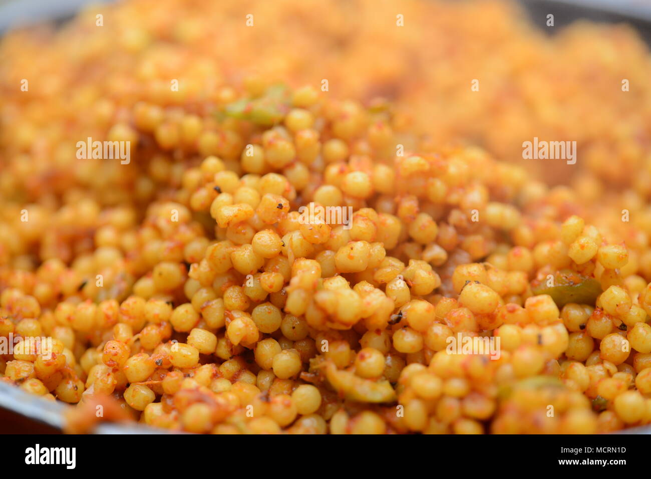 Ptitim is a type of toasted pasta shaped like rice grains or little balls developed in Israel in the 1950s when rice was scarce. Outside Israel, it is Stock Photo
