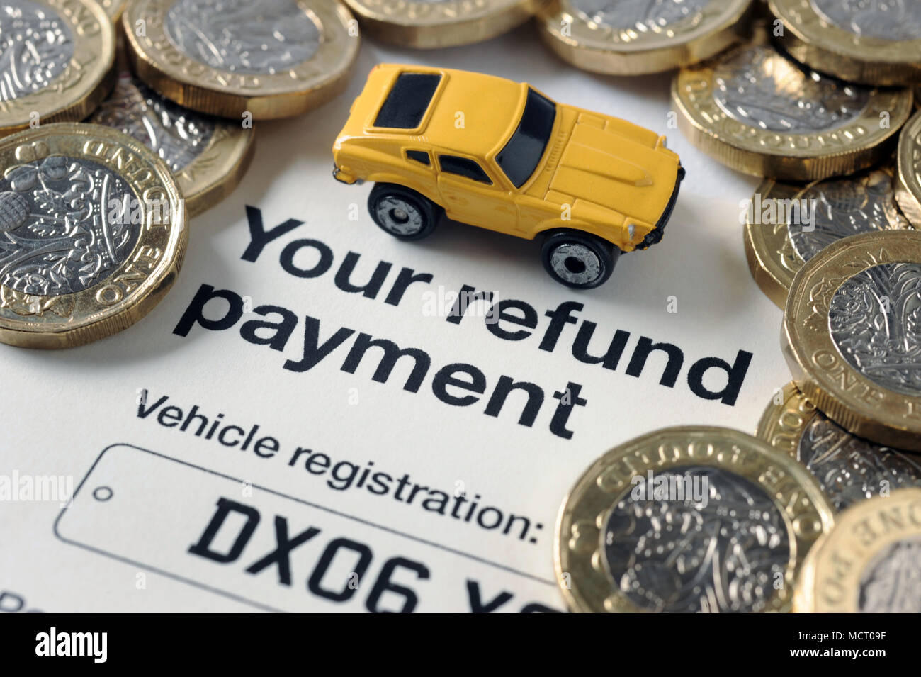 DVLA CAR TAX REFUND PAYMENT LETTER WITH MODEL CAR AND MONEY UK Stock Photo