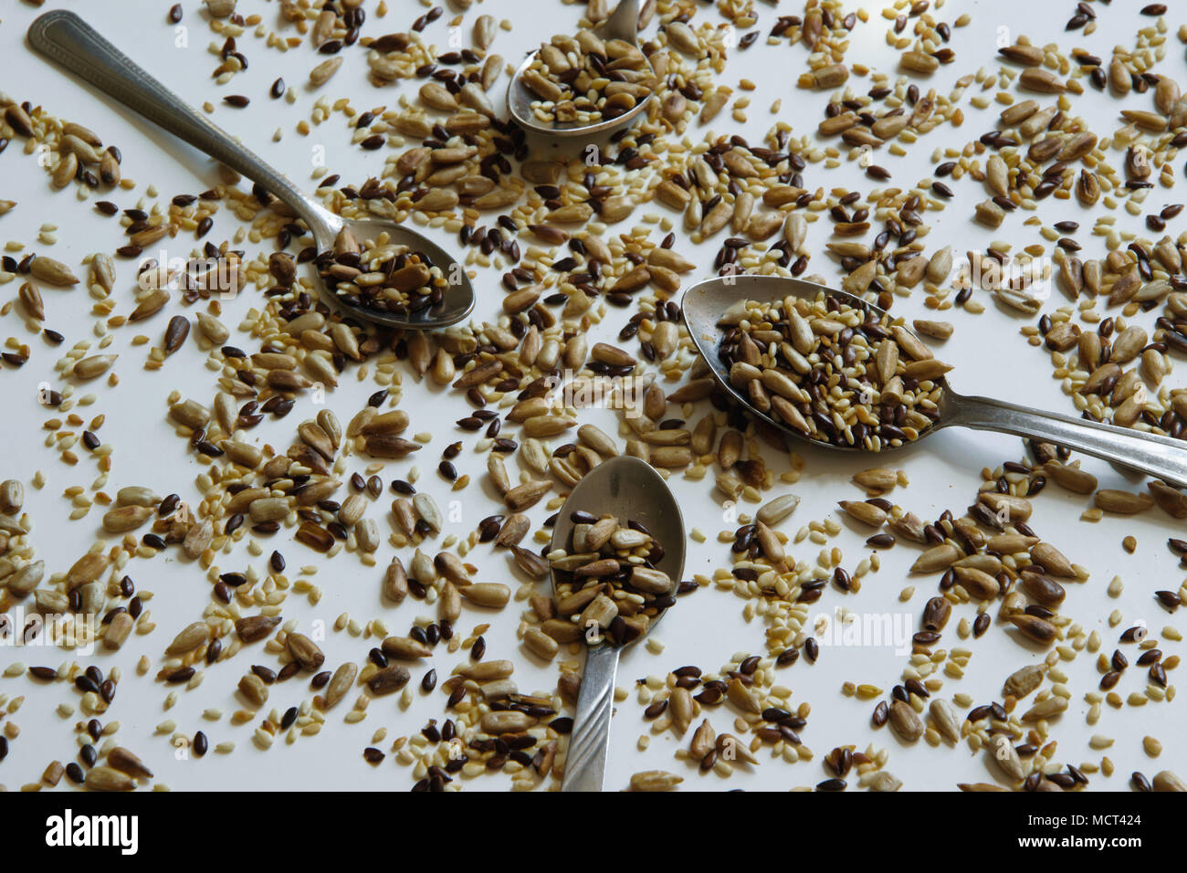 Top view of toasted mix of seeds sunflower, lin and sesame seeds