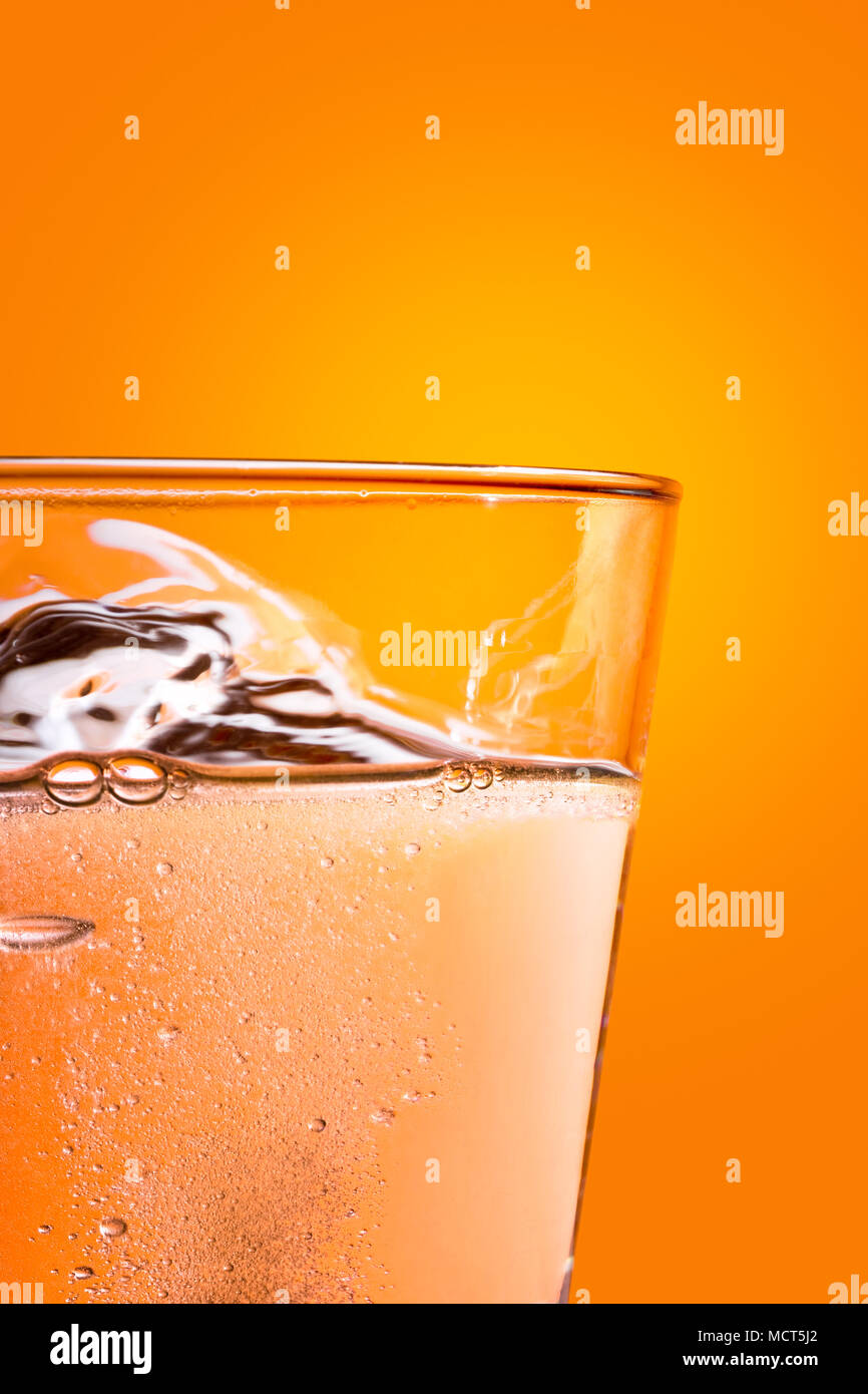 Effervescence tablet dissolving on a glass of water Stock Photo