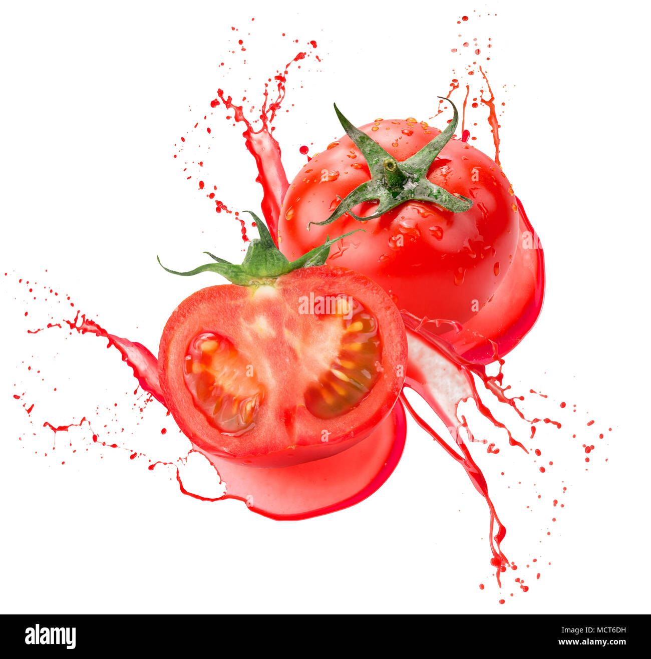 tomatoes in juice splash isolated on a white background Stock Photo - Alamy