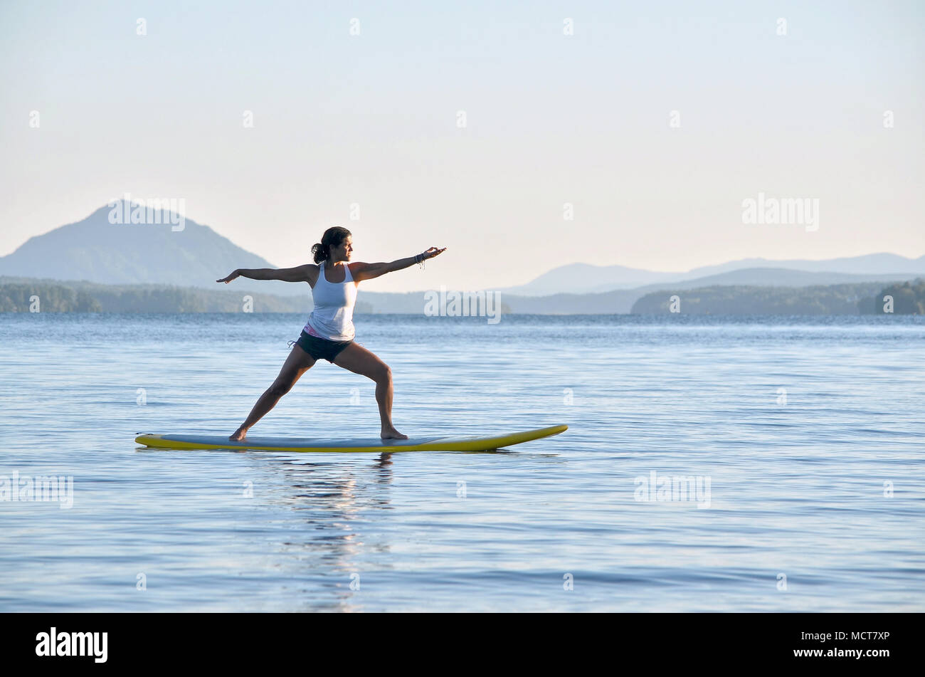 Yoga on stand up paddle board Stock Photo Alamy