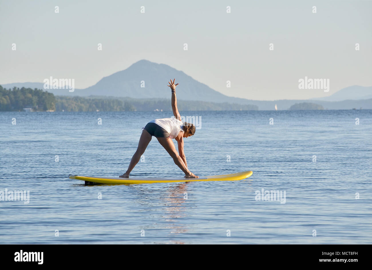 Yoga on stand up paddle board Stock Photo Alamy