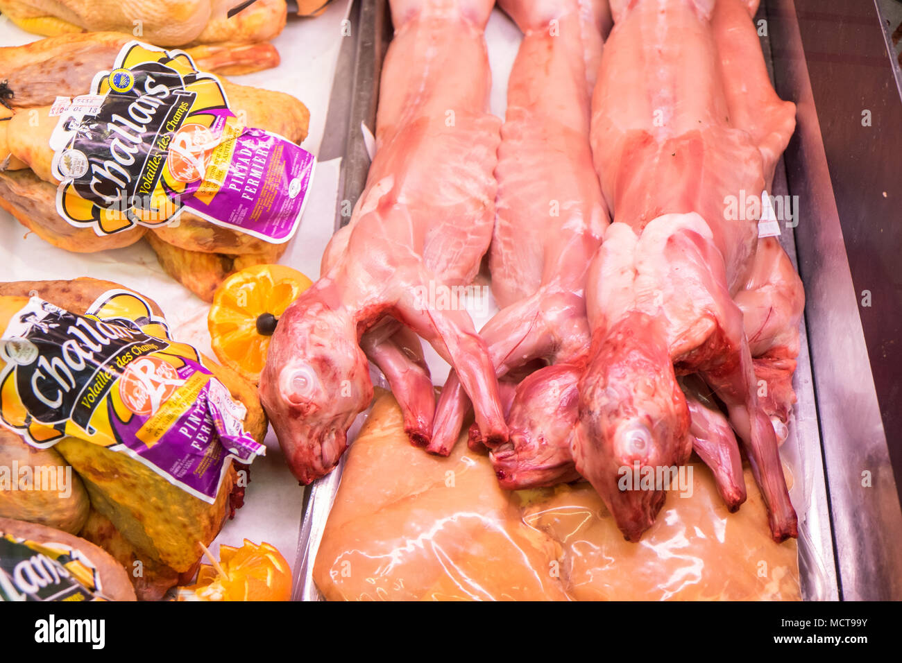 Butcher selling rabbit hires stock photography and images Alamy