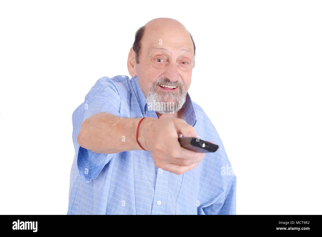 Senior man watching tv with remote control. Entertainment concept. Isolated white background Stock Photo