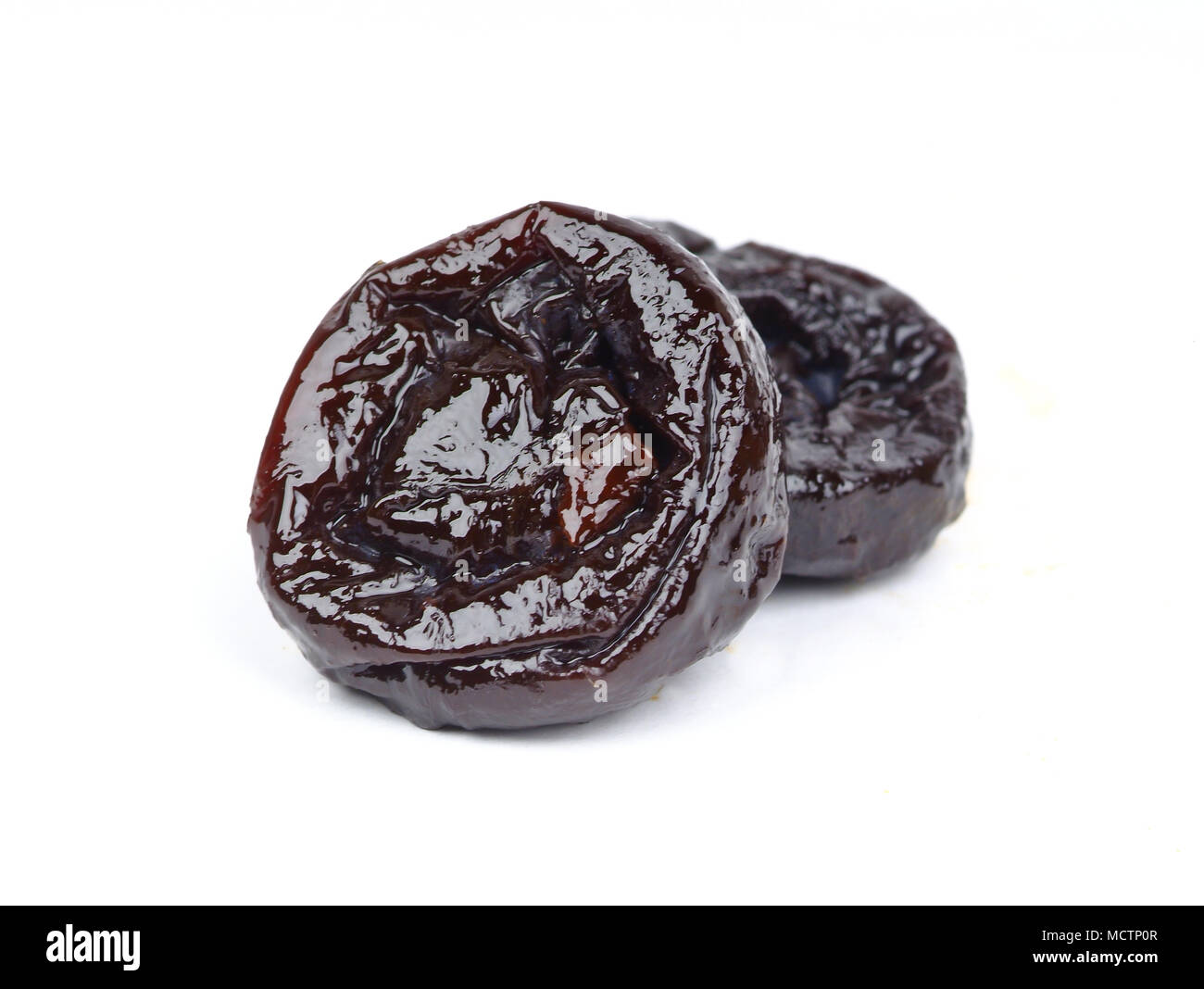 Prunes on a white background Stock Photo - Alamy