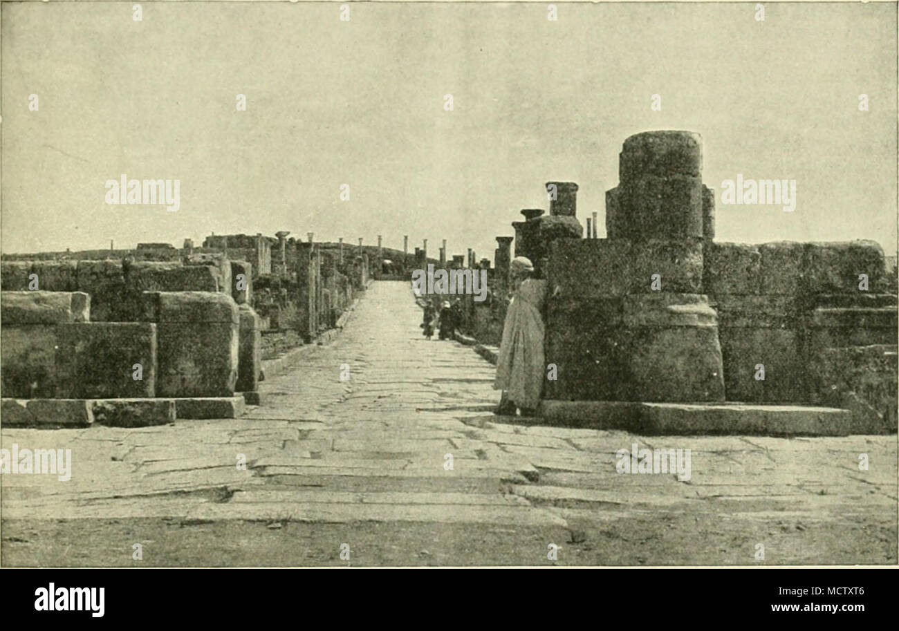 . MERIDIAN STKElil&quot; .^T TIMOAO. iBy the courUsy of the Clarendon Press^ Oxford.) Timgad. It was the usual civil settlement which was essential to a permanent Roman camp. It was not a garrison town, though built so as to be easily defended, but was the commercial centre and recruiting-ground for the neighbouring camp and the nursery of Roman civilisation in the surrounding region. By a.d. 123 the camp of the legion was fi.xed thirteen miles west- ward of Timgad, at Lambjesis. Like all Roman military colonies, Timgad is built like a Roman camp. In its original form it is almost a true squar Stock Photo