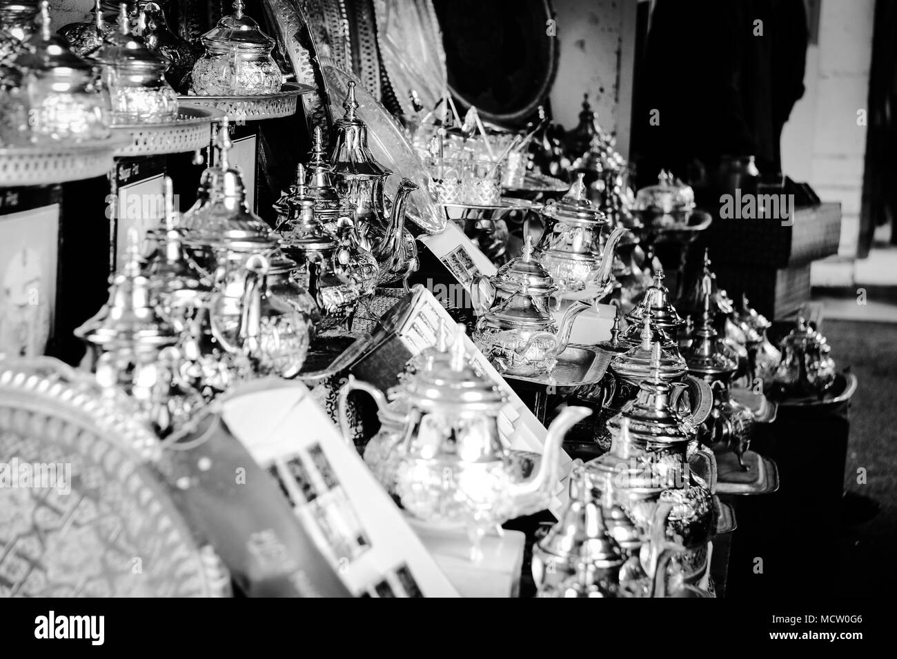 Black and white picture of traditional tin cans and tea cups at the old souk in Casablanca, Morocco Stock Photo
