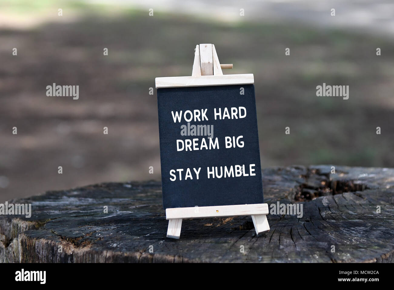 Inspirational quote - Work hard, dream big, stay humble, on black board. Stock Photo