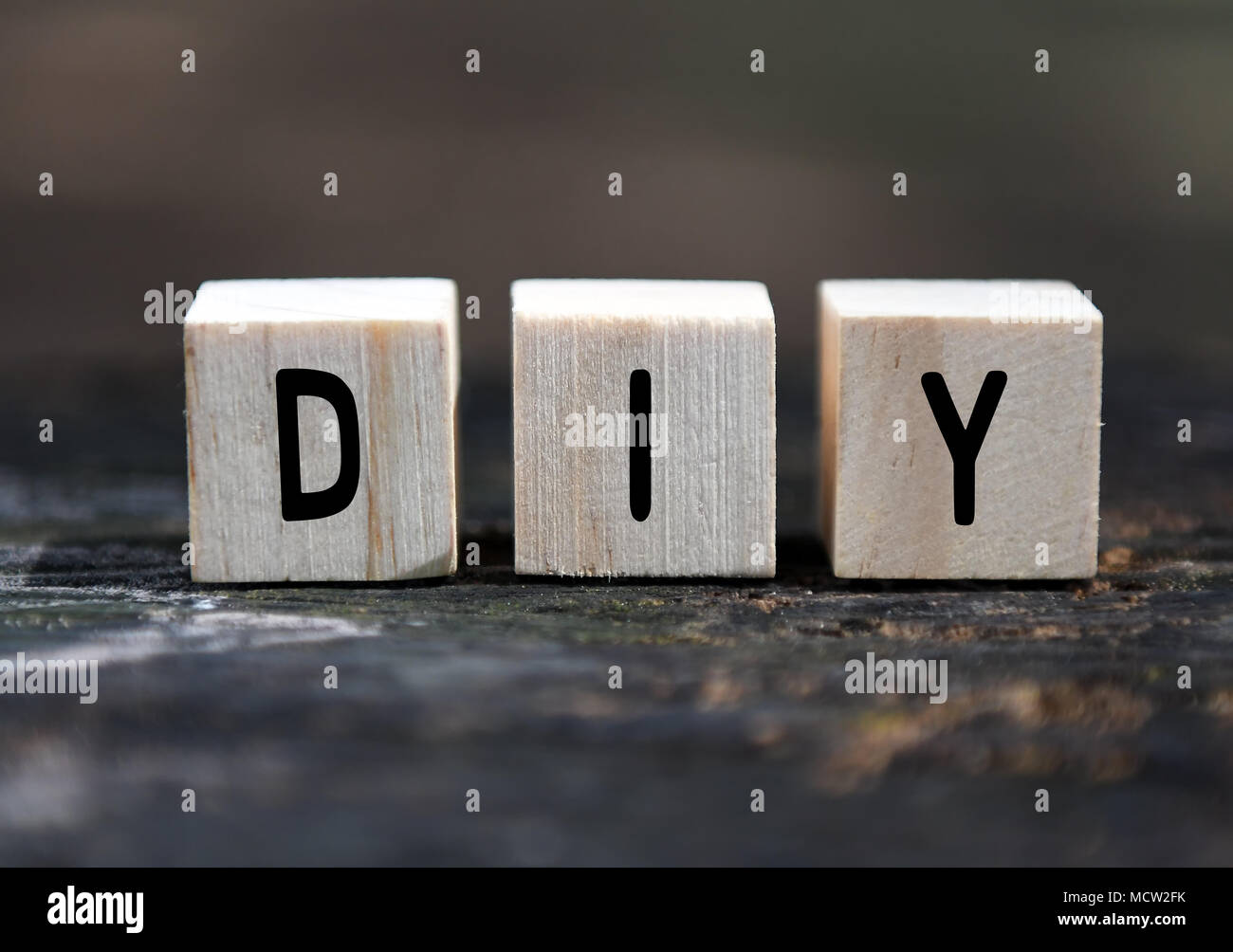 DIY word on wood blocks with blurry background Stock Photo
