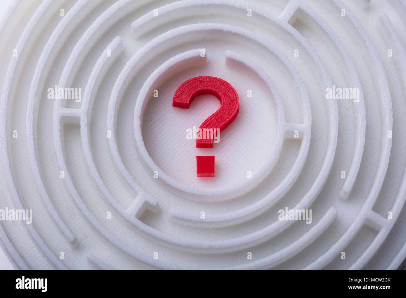 Elevated View Of Maze With Red Question Mark In Center Stock Photo