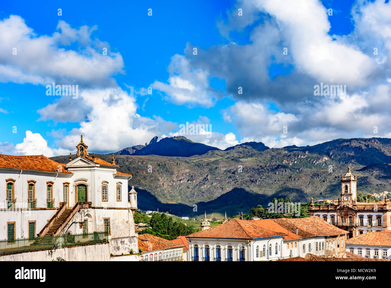 Top view of the center of the historic Ouro Preto city in Minas Gerais, Brazil with its famous churches and old buildings with hills in background Stock Photo