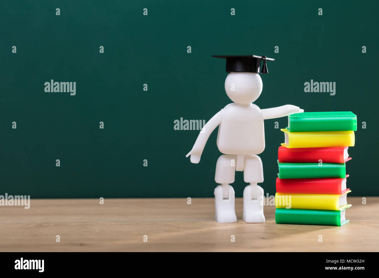 Graduation cap on stack books hires stock photography and images Alamy