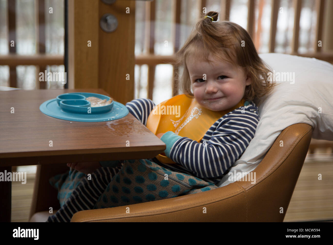 Toddler eating breakfast Stock Photo