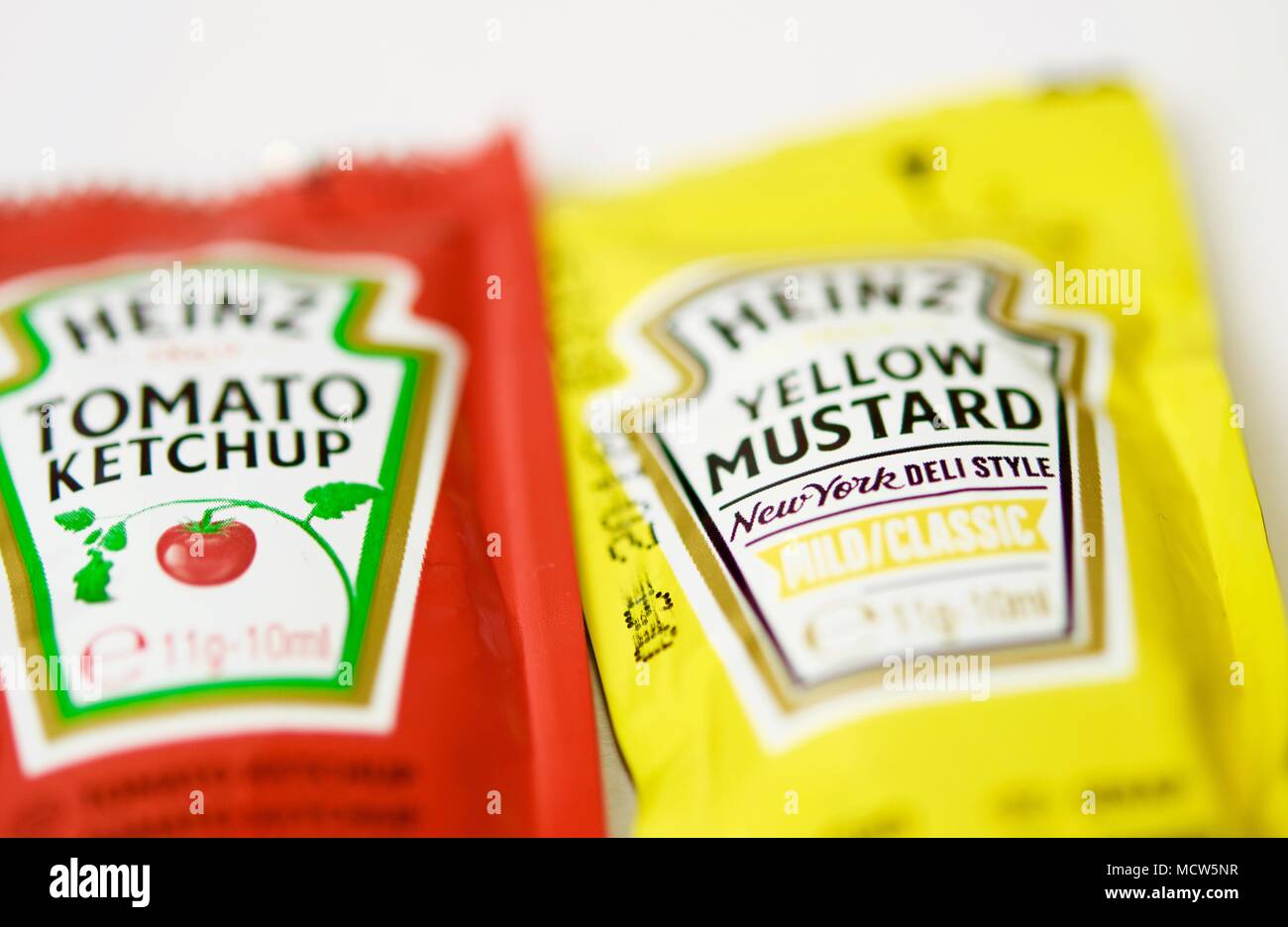 Ketchup and mustard from Heinz brand in sachets Stock Photo Alamy