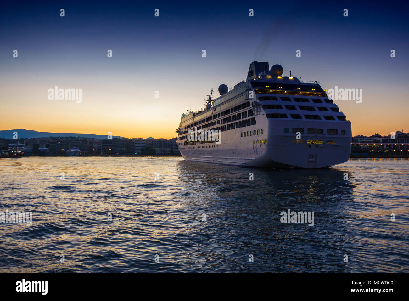 Cruise ship on sea during sunset, Athens, Greece Stock Photo