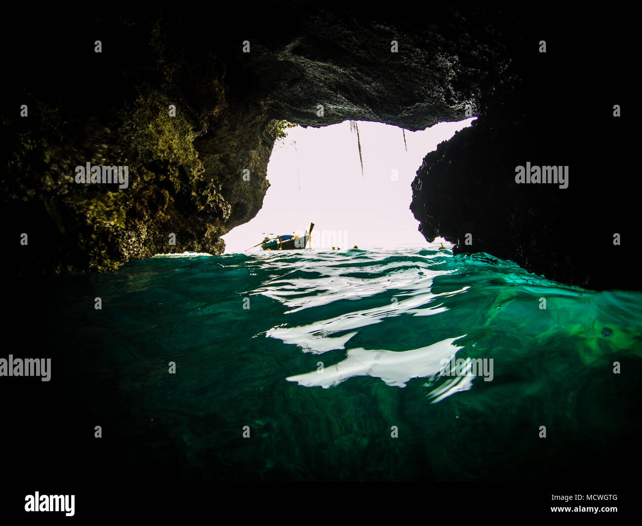 Action cam picture of the entrance of the Emerald cave (mokarot cave) in Ko Muk, Ko Lanta, Thailand. Stock Photo