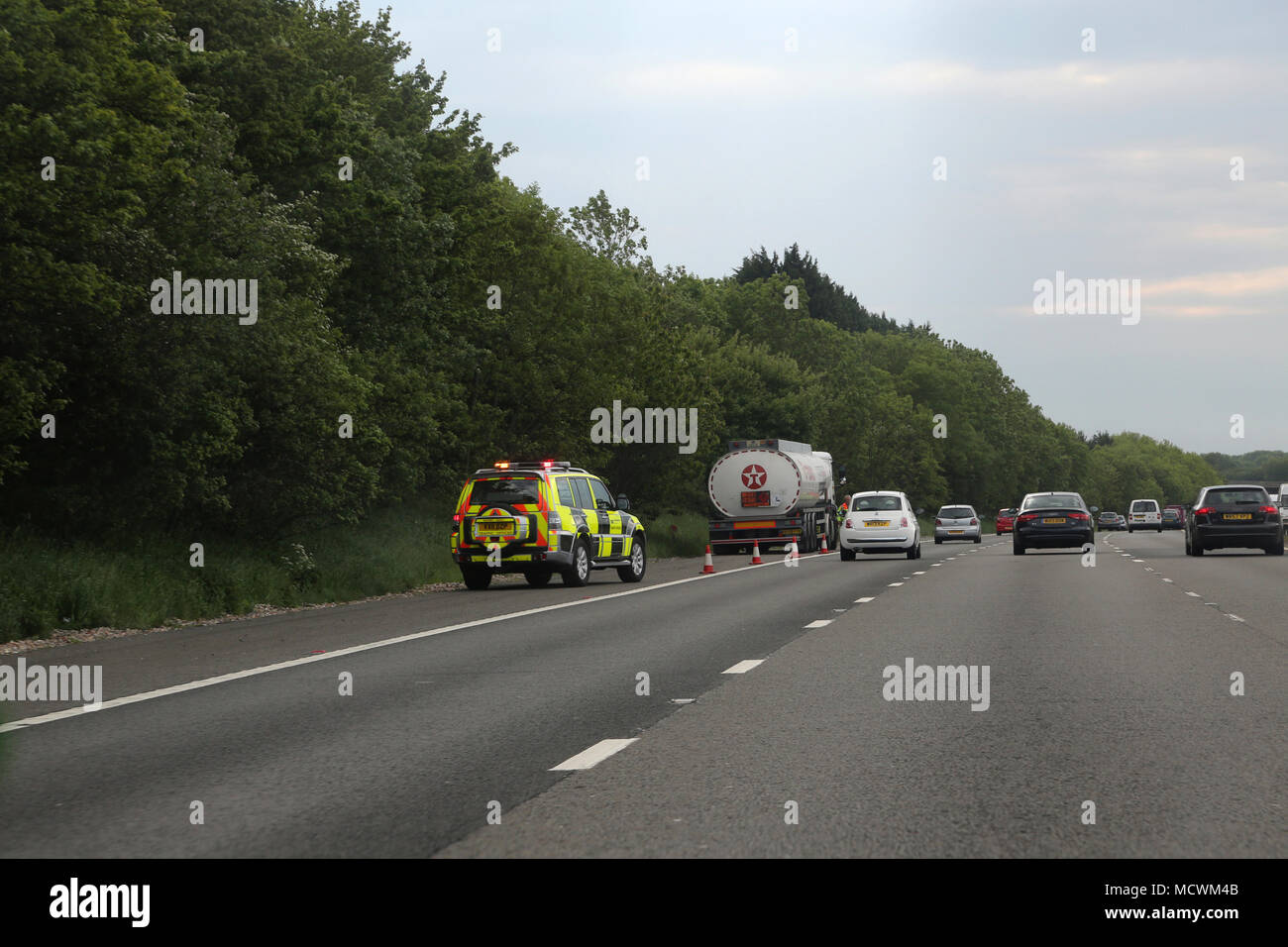 Traffic Police Pull Over A Oil Tanker Lorry on the Hard Shoulder of the M4 England Stock Photo