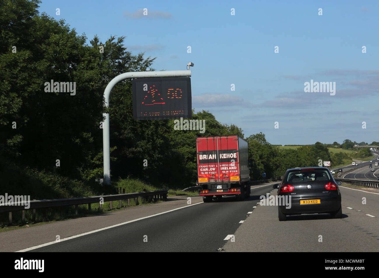 Electronic Sign Slow Down on M4 Motorway England Stock Photo