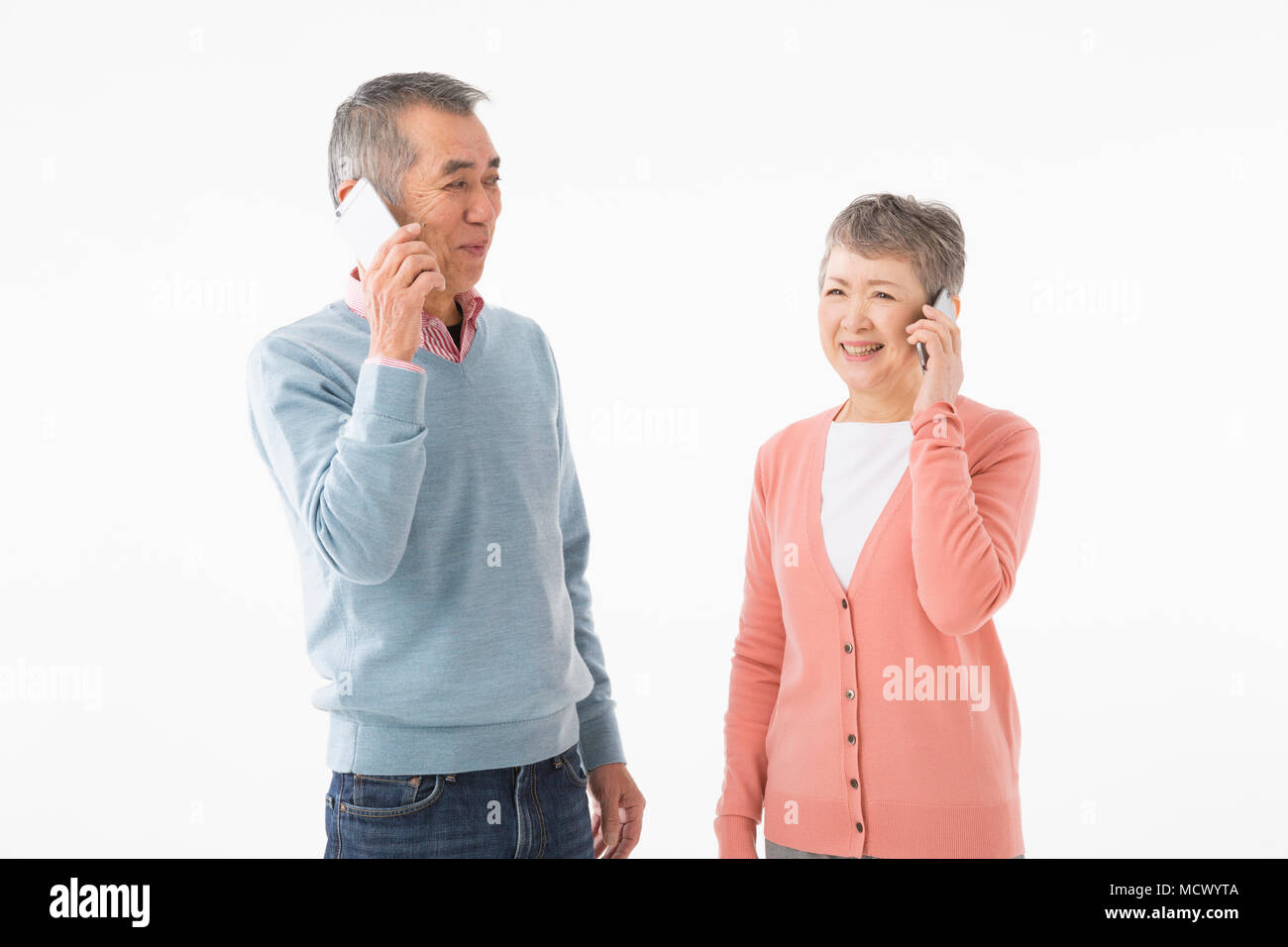 Senior couple talking on smart phone Stock Photo