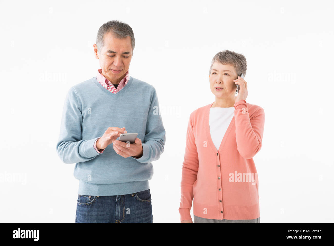 Senior couple talking on smart phone Stock Photo