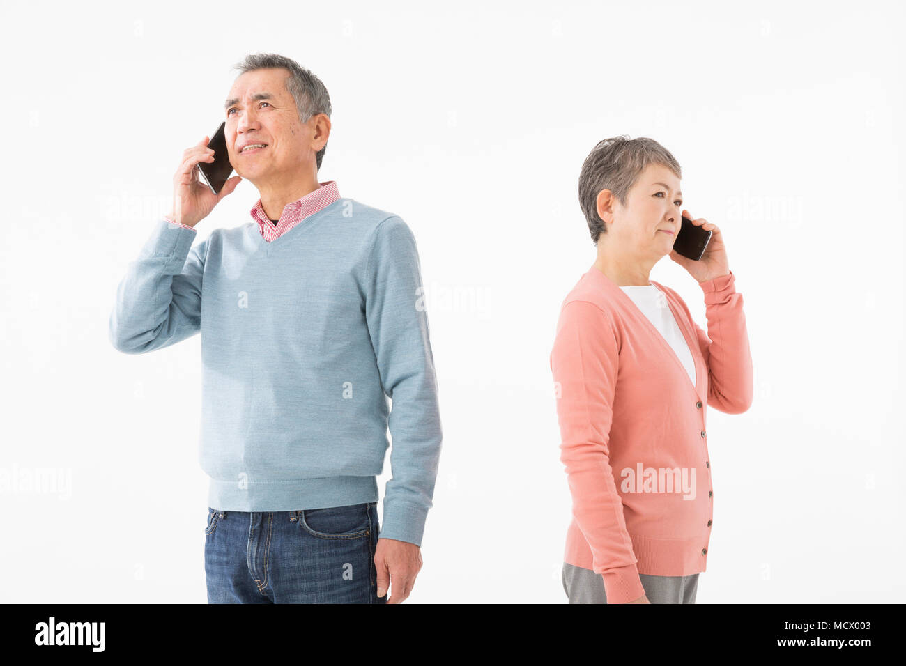 Senior couple talking on smart phone Stock Photo