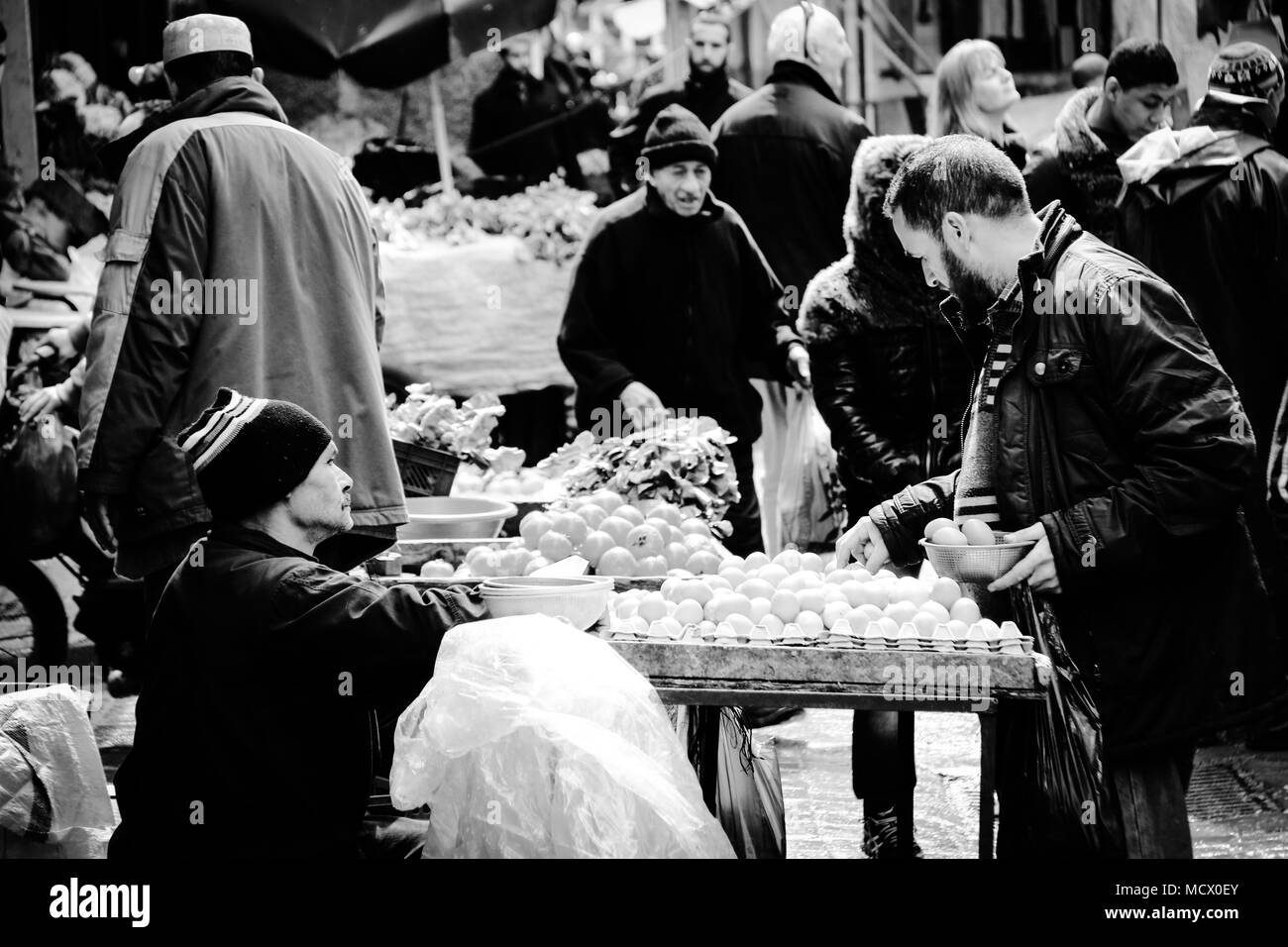 Old fashioned black and white picture of Arabian people buying and selling on the old souk in Casablanca, Morocco Stock Photo