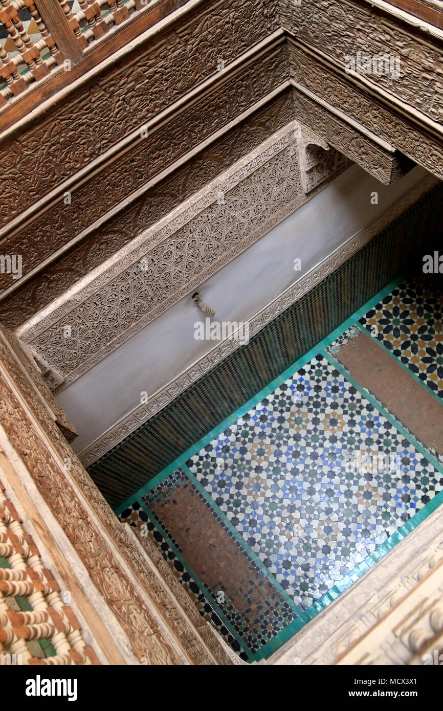 Courtyard with typical Moroccan tiled floor at the Ben Youssef Madrasa (Qur'anic school) in Marrakesh, Morocco Stock Photo