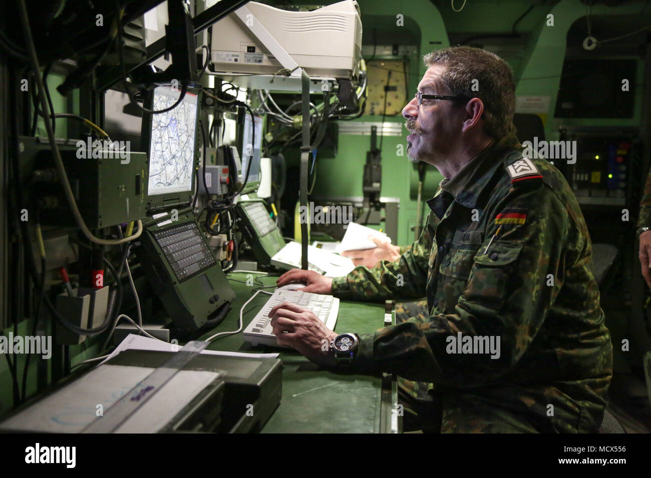 A German soldier of the 131st Field Artillery Battalion operates a work ...
