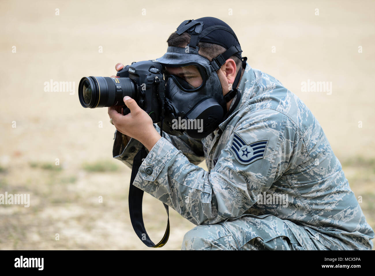 Staff Sgt. Agustin G. Salazar, a public affairs specialist with the 149th Fighter Wing, takes photos of competitors during the 2018 Texas Military Department Best Warrior Competition March 3, 2018, at Camp Swift in Bastrop, TX. The Best Warrior Competition brings together the best junior enlisted and noncommissioned officers from the Texas Air and Army National Guards to compete for the prestigious title. (Air National Guard Photos by Staff Sgt. Daniel J. Martinez) Stock Photo