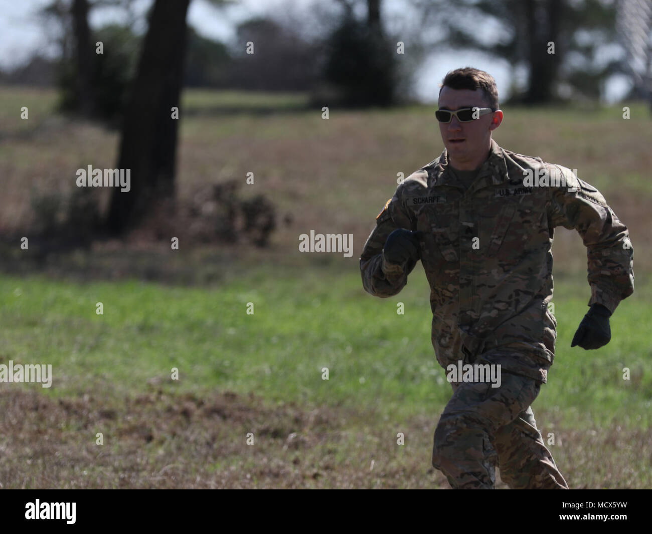Texas Army National Guard Sgt. Peter Scharff of the the 176th Engineering Brigade sprints to the first obstacle of the Texas Military Department Best Warrior Competition, March 1, 2018 at Camp Swift near Bastrop, Texas. The competition brought 31 competitors together from across the Texas Army and Air National Guards, the Chilean Armed Forces and the Czech Republic military. (U.S. Army National Guard photo by Spc. Jason Archer) Stock Photo