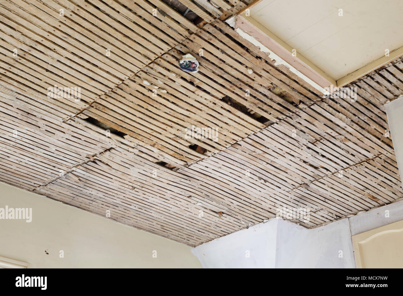 Old plaster and lath ceiling in a house Stock Photo