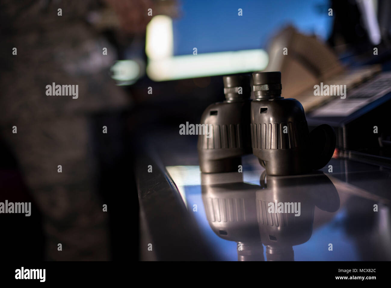 Vance air traffic controllers use many tools to assist them in controlling the airspace, such as binoculars. Binoculars are a tool that allow them to see greater distances. (U.S. Air Force photo by Airman Zachary Heal) Stock Photo