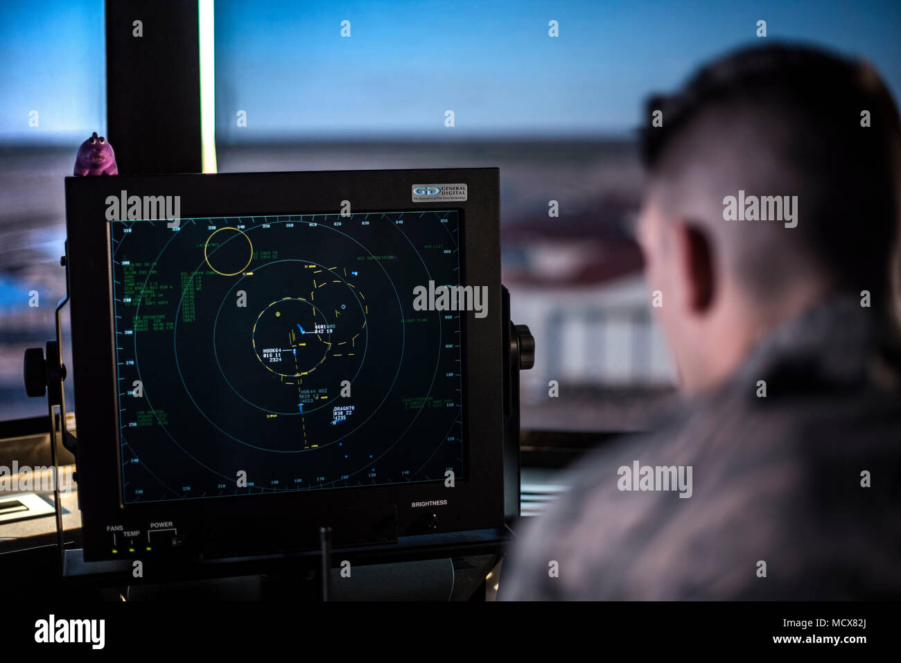 SSgt Chase Kelly, an air traffic controller, monitors airspace from the Inhofe Air Traffic Control Tower, March 1, 2018, at Vance Air Force Base, Okla.  One of only four bases in the Air Force that has a primary pilot training mission, Vance averages more flights per hour than many major commercial airfields. (U.S. Air Force photo by Airman Zachary Heal) Stock Photo