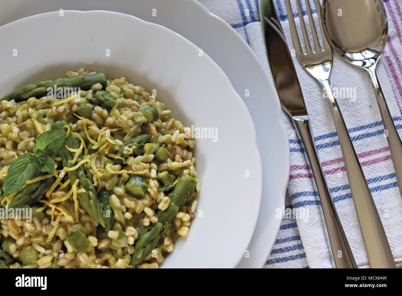 saffron risotto with asparagus 5 Stock Photo Alamy