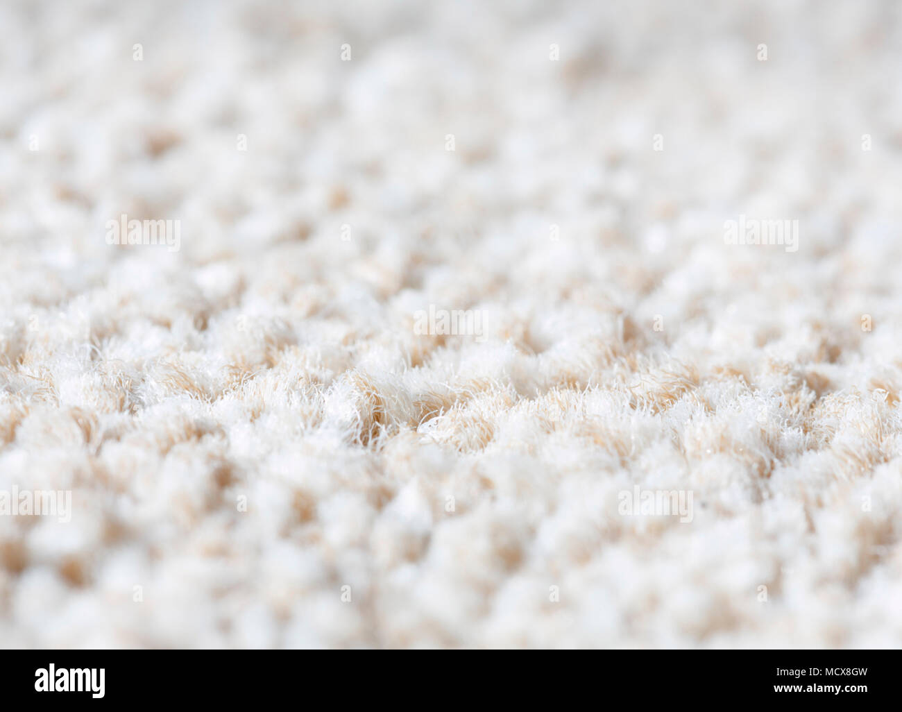 Neutral plain wool carpet rug texture closeup Stock Photo