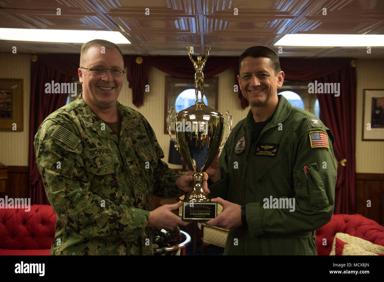 180302-N-QE928-010 BREMERTON, Wash. (March 2, 2018) Capt. Edward Alan Schrader, commanding officer of Naval Base Kitsap presents the Naval Base Kitsap Captain’s Cup trophy to Capt. Greg Huffman, commanding officer of USS John C. Stennis (CVN 74), aboard the ship. The Captain’s Cup is an element of the Navy’s intramural sports program and is presented to the team with the most points at the end of the calendar year.  John C. Stennis is in port conducting training as it continues preparing for its next scheduled deployment. (U.S. Navy photo by Mass Communication Specialist Seaman Erika Kugler/Re Stock Photo