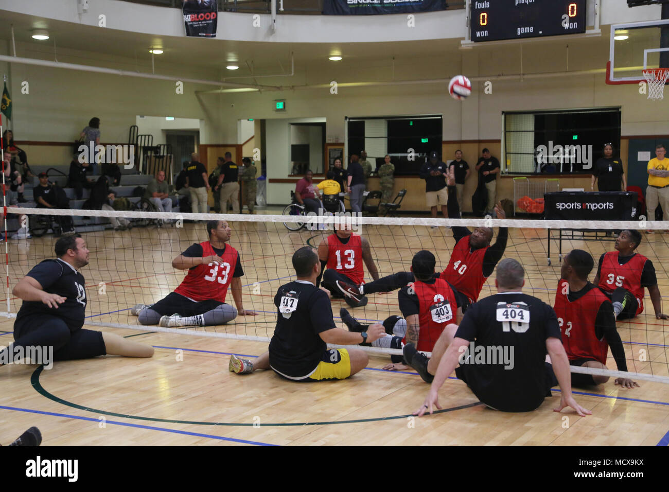 Athletes participate in the 2018 Army Trials in seated volleyball at Fort Bliss, Texas, March 3, 2018. 74 wounded, ill, or injured active duty Soldiers and veterans participate in a series of events that are held at Fort Bliss, Texas, Feb. 27 through March 9, 2018, as Deputy Chief of Staff, Warrior Care and Transition hosts the 2018 U.S. Army Trials. (U.S. Army photo by Pfc. Tescia Mims) Stock Photo
