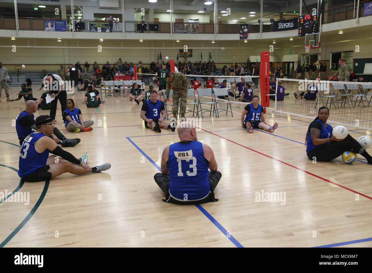 Athletes participating in the 2018 Army Trials engage in practice drills before the start of a volleyball competition at Fort Bliss, Texas, March 3, 2018. 74 wounded, ill, or injured active duty Soldiers and veterans participate in a series of events that are held at Fort Bliss, Texas, Feb. 27 through March 9, 2018, as Deputy Chief of Staff, Warrior Care and Transition hosts the 2018 U.S. Army Trials. (U.S. Army photo by Pfc. Tescia Mims) Stock Photo