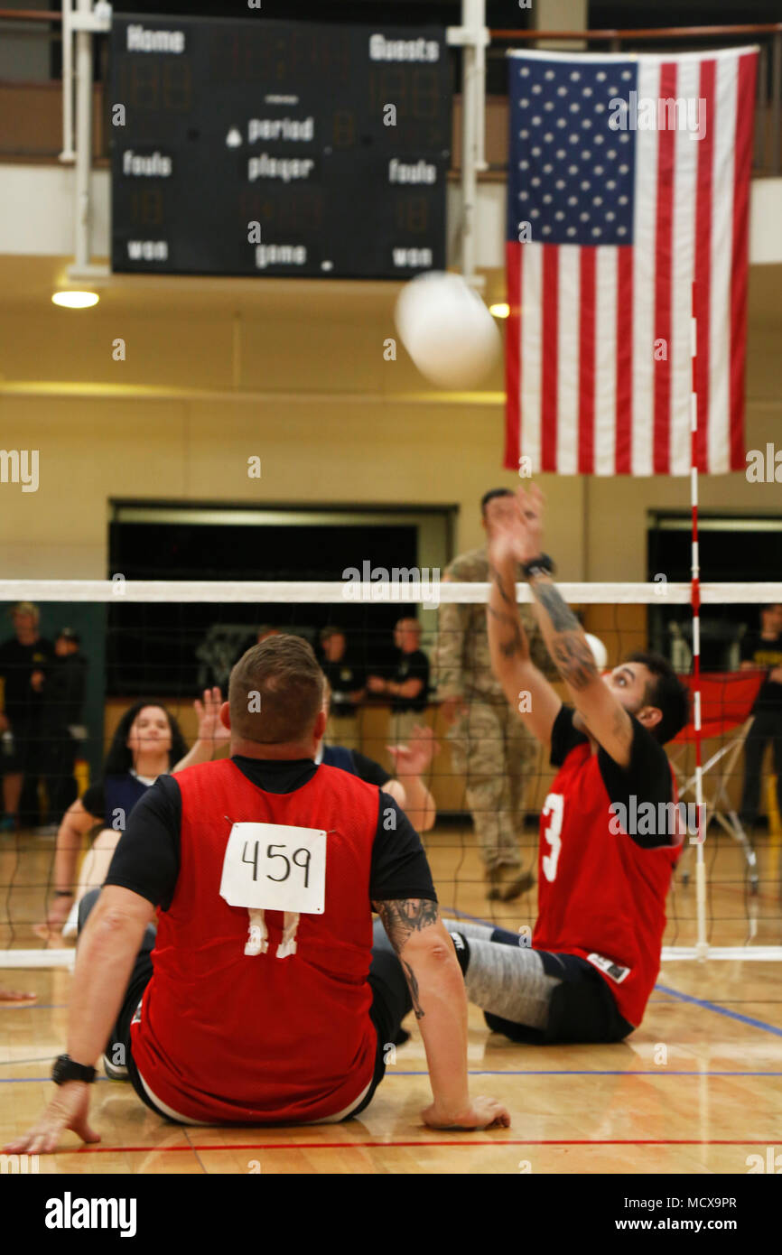 U.S. Army Sgt. Ernesto Altamirano (right), assigned to Warrior Transition Battalion, Walter Reed, hits a ball during the volleyball competition in the 2018 Army Trials at Fort Bliss, Texas, March 3, 2018. 74 wounded, ill, or injured active duty Soldiers and veterans participate in a series of events that are held at Fort Bliss, Texas, Feb. 27, 2018 through March 9, 2018 as the Deputy Chief of Staff, Warrior Care, and Transition hosts the 2018 U.S. Army Trials. (U.S. Army photo by Spc. Miguel Pena) Stock Photo