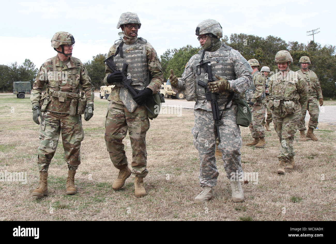 U.S. Army Reserve Soldiers Sgt. 1st Class Jordan Willsey and 2nd Lt. Jemel Jones from the 295th Quarter Master BN converse with Maj. Gen. A. Ray Royalty, 84th Training Command, as they walk towards the bath and laundry site to display the unit’s field operation. CSTX 78-18-03 is a Combat Support Training Exercise that ensures America's Army Reserve units and Soldiers are trained and ready to deploy on short-notice and bring capable, combat-ready, and lethal firepower in support of the Army and our joint partners anywhere in the world. ( U.S. Army Reserve photo by Staff Sgt. Christopher Sofia.) Stock Photo