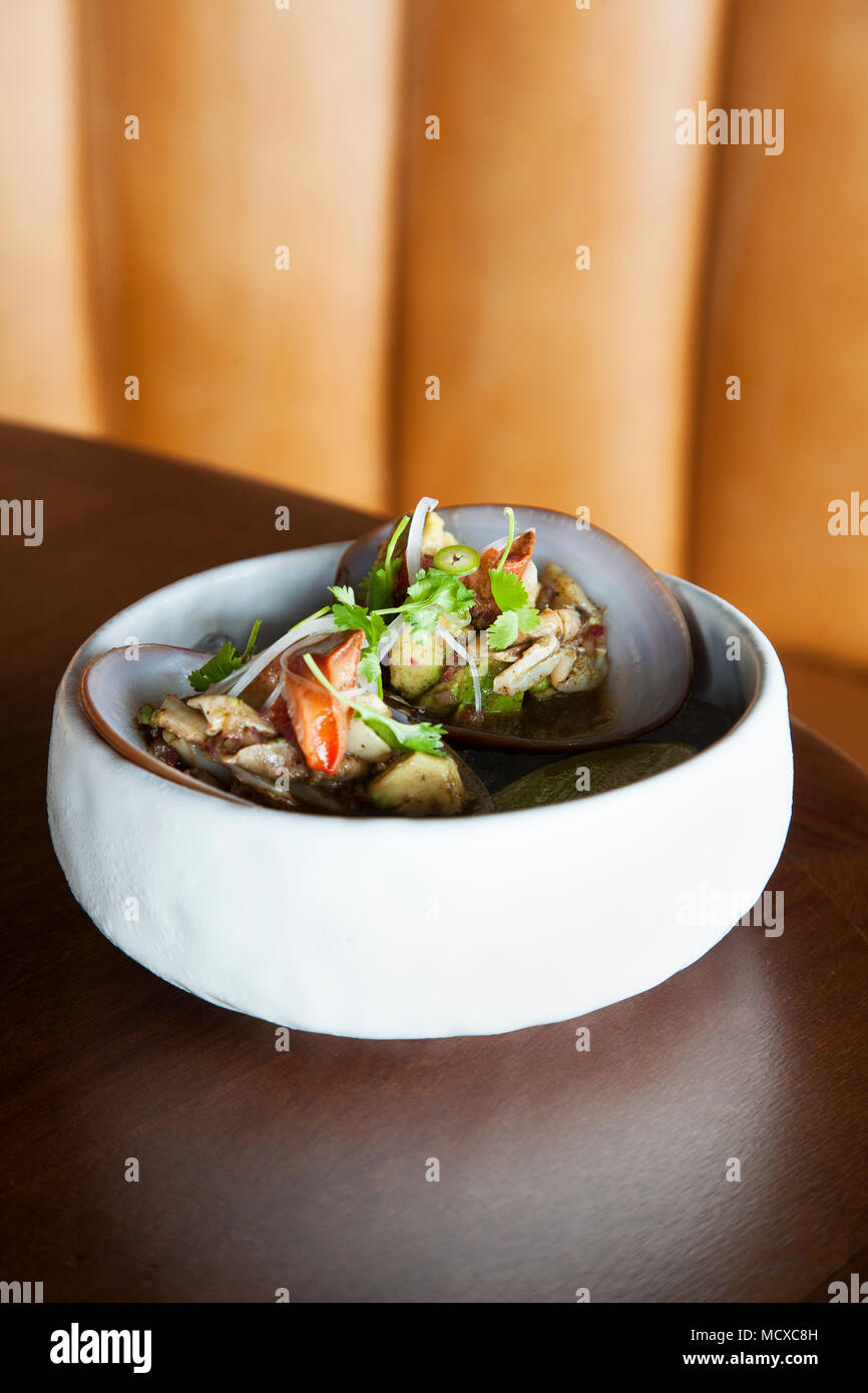 Chocolate clams with black garlic aguachile from Manta Los Cabos, Baja