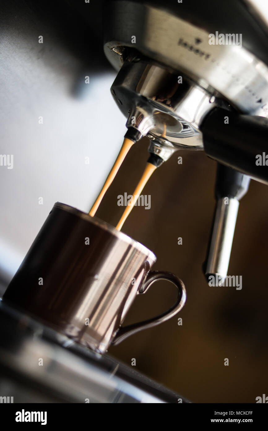 espresso machine pouring coffee to cup Stock Photo Alamy
